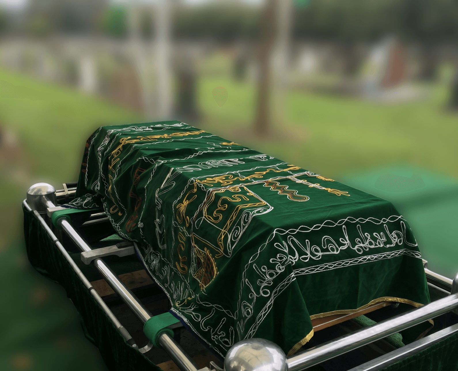 Green janazah casket with calligraphy prepared for burial